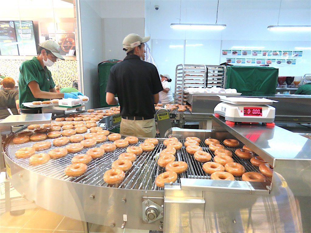 Krispy Kreme donut manufacturing machine at first shop in Medellín